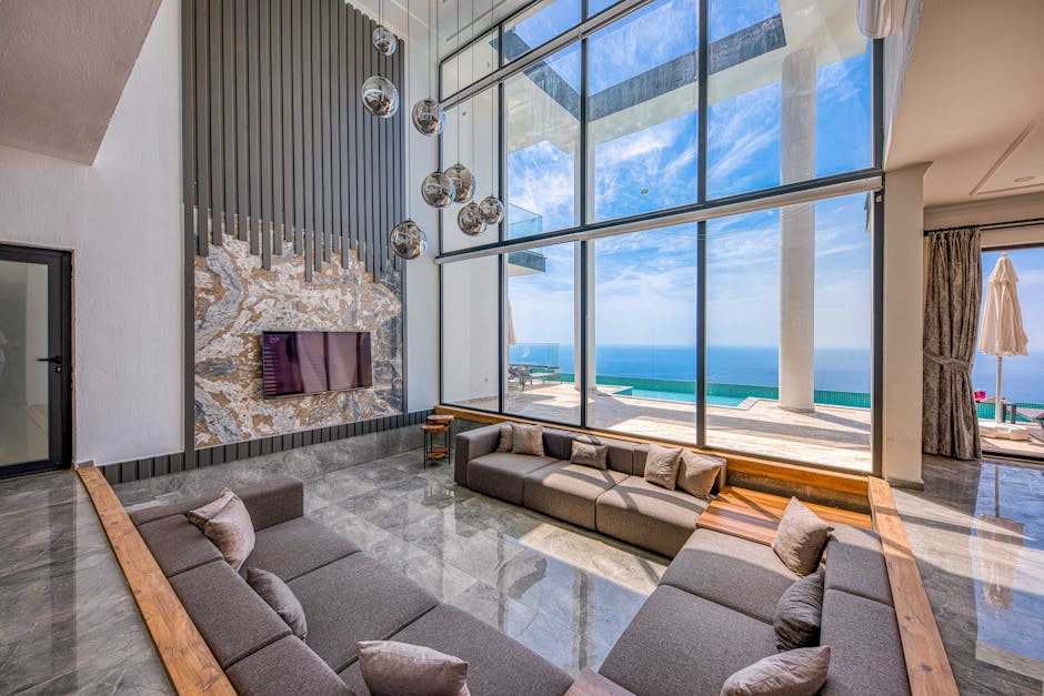 Spacious living room with ocean views, modern design, and elegant decor